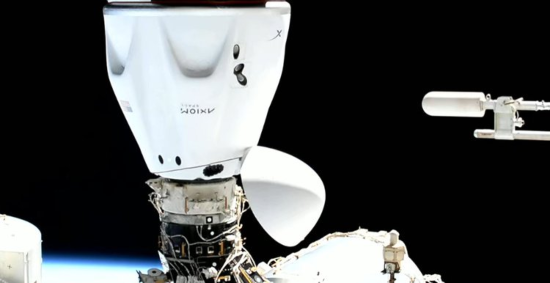 The Axiom vehicle docking at the space station.