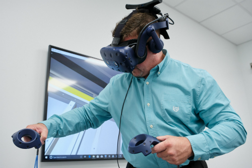 Employee demonstrates VR technology